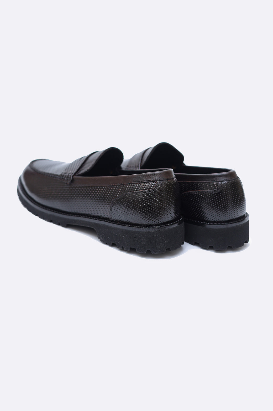 Pair of men's dark brown perforated leather penny loafers featuring a classic saddle strap and a thick black rugged lug sole.
