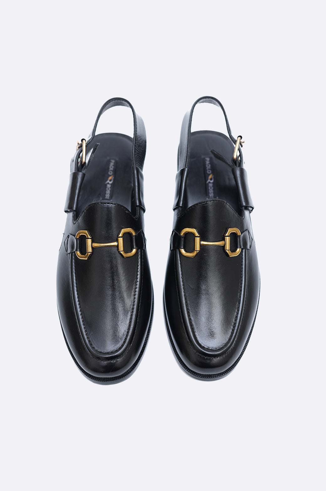 Pair of premium men's black leather closed-toe sandals with gold horsebit hardware and adjustable slingback heel straps.