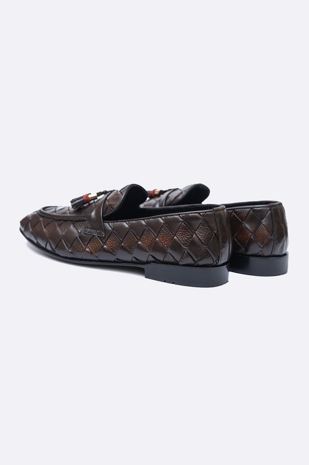 Pair of premium men's dark brown hand-woven leather loafers featuring twin tassels with gold-tone accents on a clean white background.