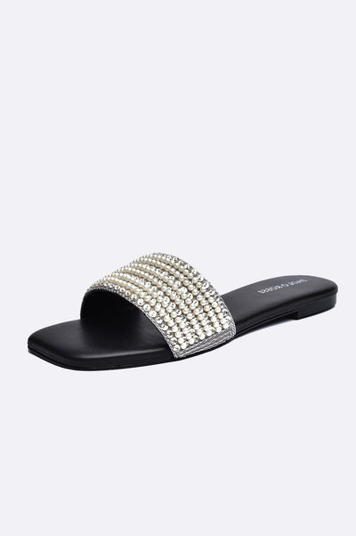 Elegant handmade black leather flats with cascading pearl and rhinestone strap, showcasing Italian designs by Paolo Rossi.